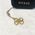 Guess Guess zawieszka GUCPM4GID Phone Strap 4G Glitter Charm