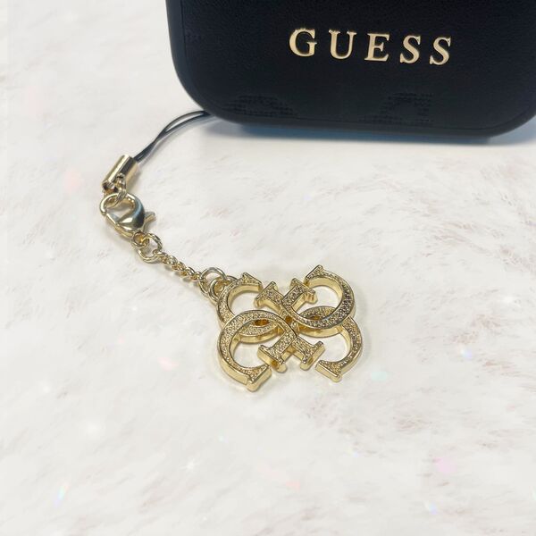 Guess Guess zawieszka GUCPM4GID Phone Strap 4G Glitter Charm