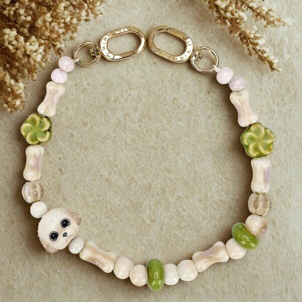 Zawieszka na torebkę handstrap Nimmy New Big Eye Cute Pets 2.0 brązowy